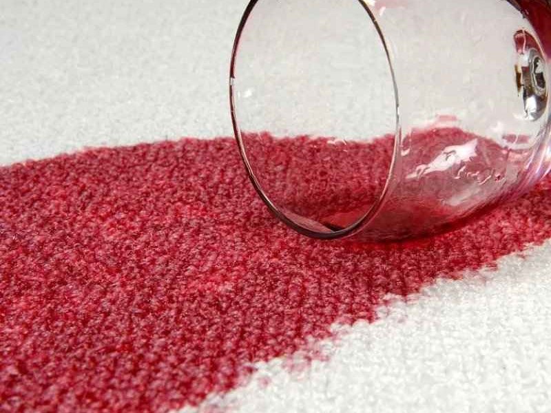 Person cleaning carpet stains