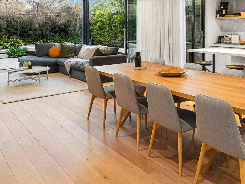 Hardwood flooring extending from the living room to the kitchen